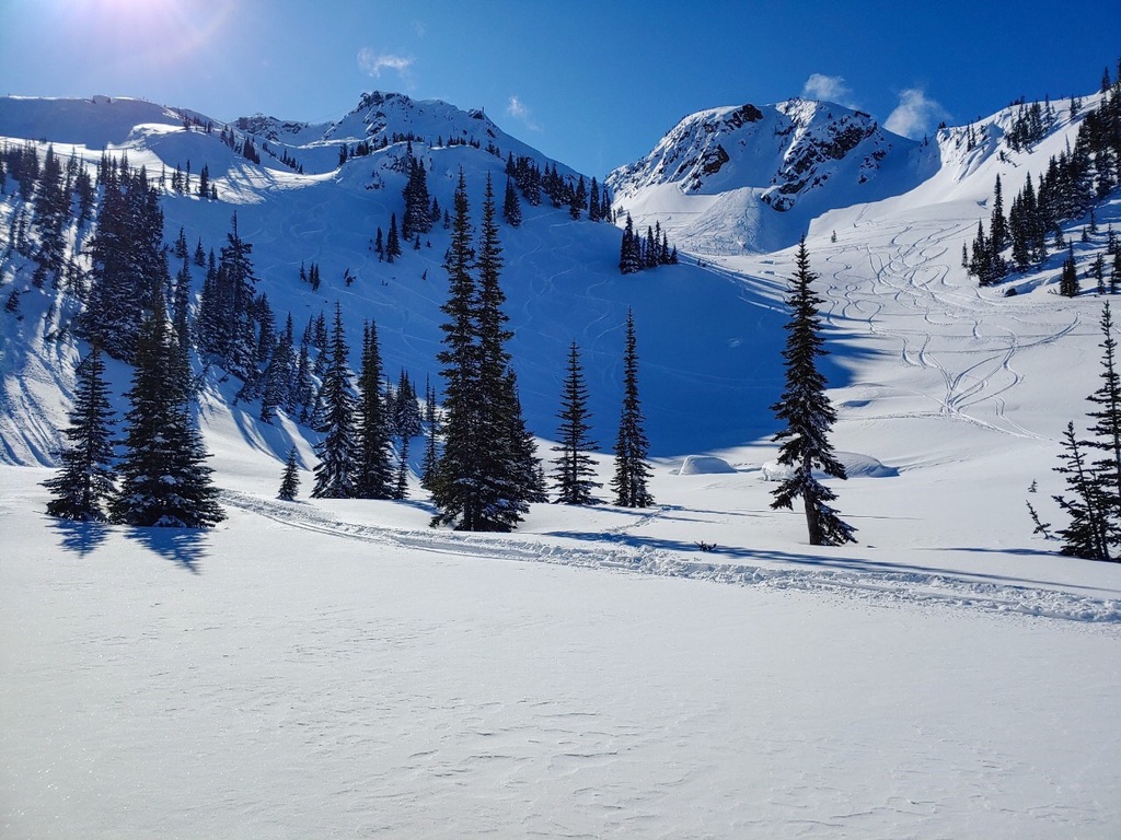 Winter mountain basin under blue sky